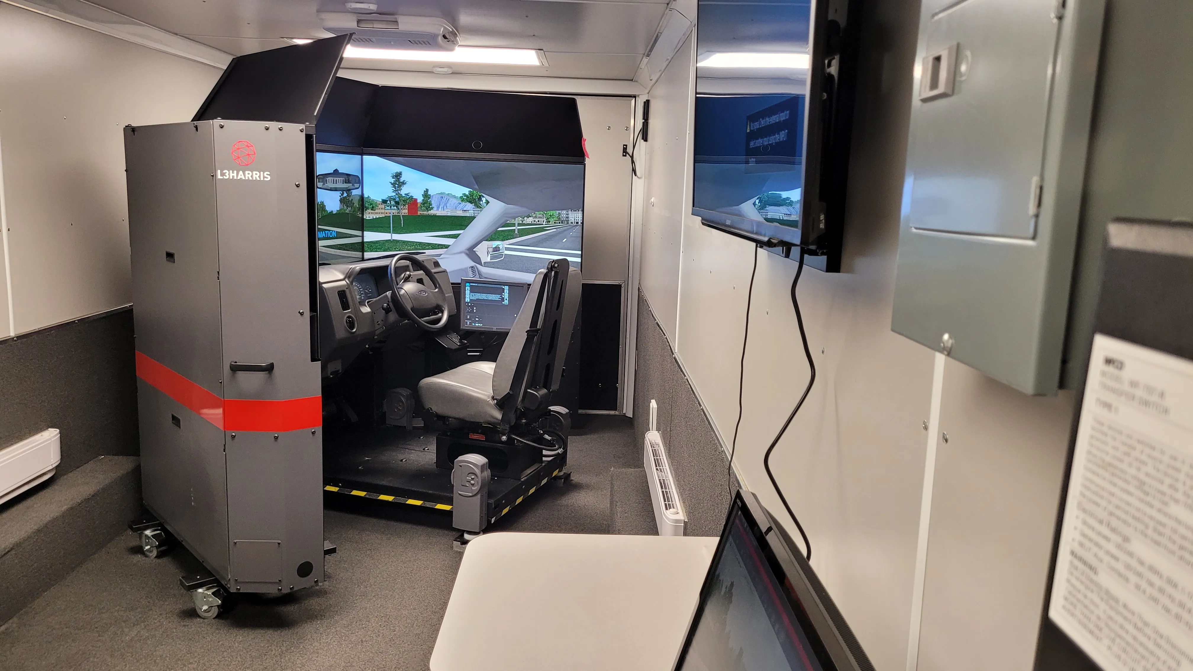 Professional driver simulator inside the mobile training unit